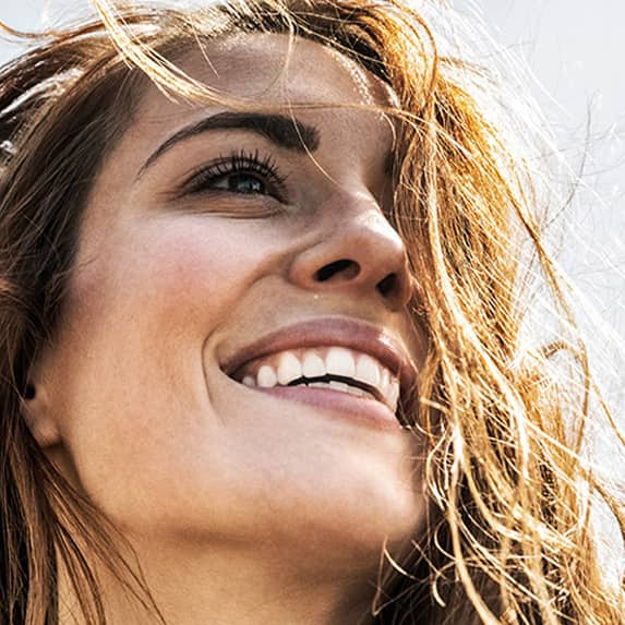 smiling woman showing white teeth